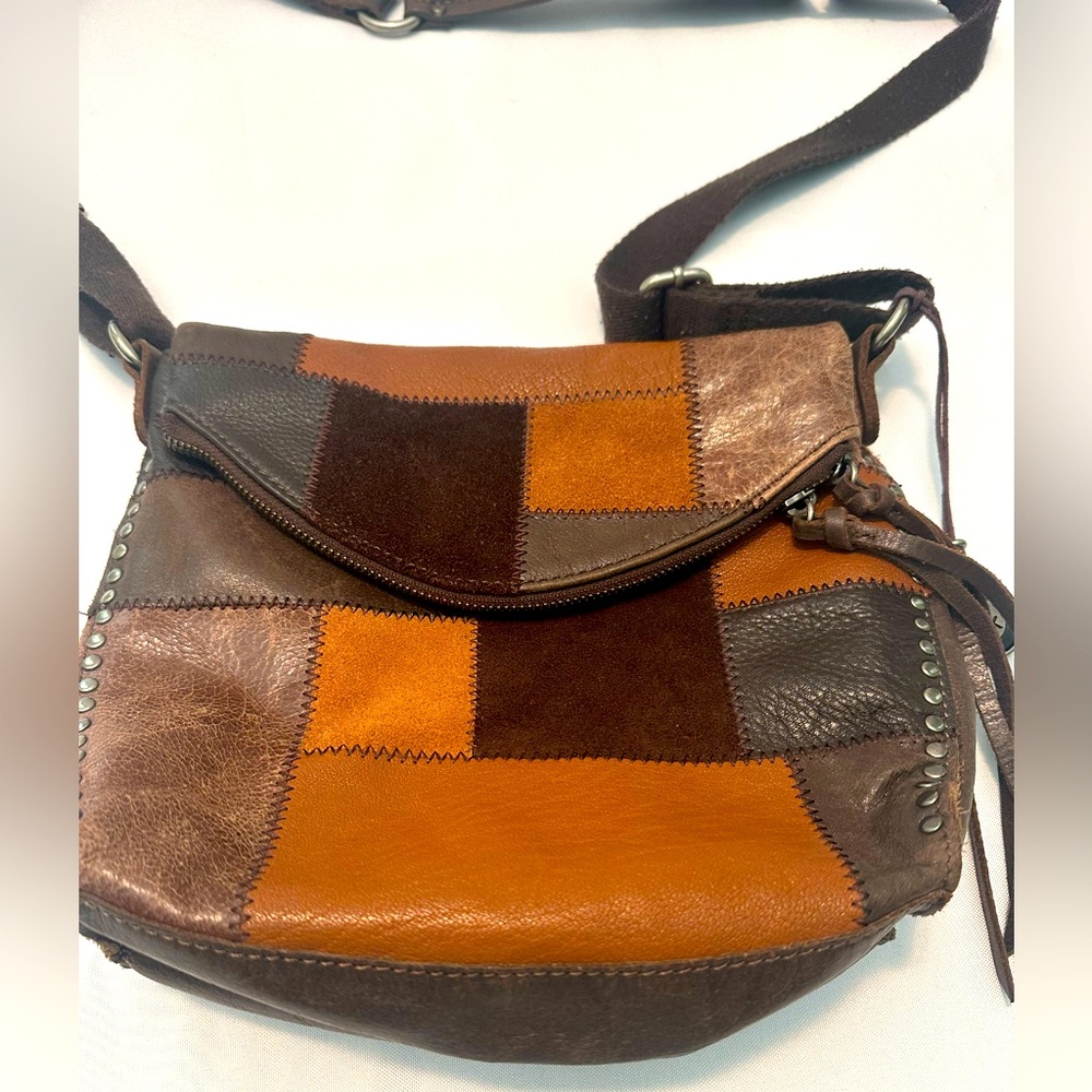The Sak Brown and Tan Leather Crossbody Bag with Flap Closure